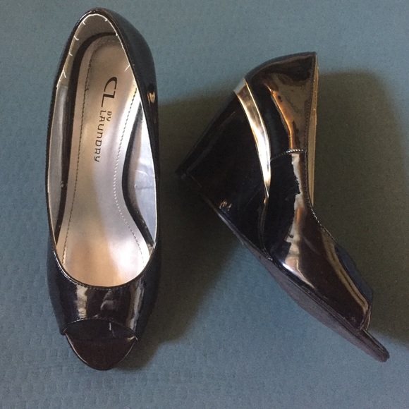 Wedges with silver stripe. Lightly worn. 4" heel