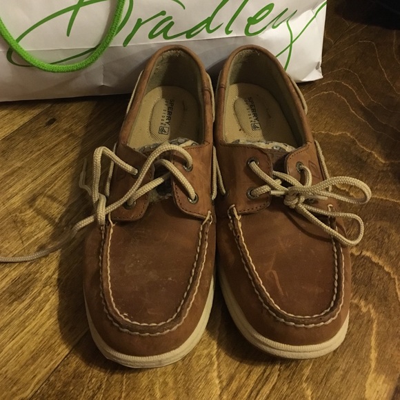 Tan sperrys with cheetah print on the side