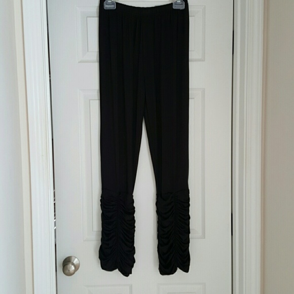 NWOT. Black soft pants with ruffled bottoms.