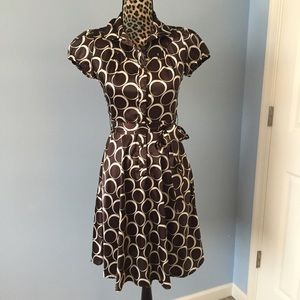 Beautiful, classy button down satin dress.