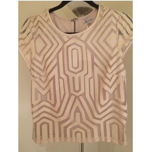 Unique pattern shirt with faux leather details.