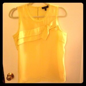 Yellow top with a "half-bow" and unfinished edges
