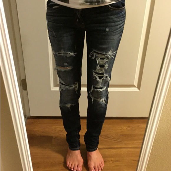 Dark blue distressed jeans
