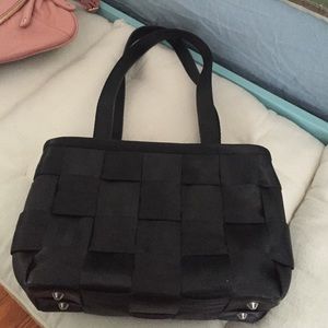 Harvey's black seat belt purse