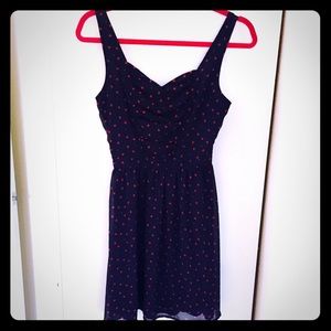 Navy dress with red hearts.