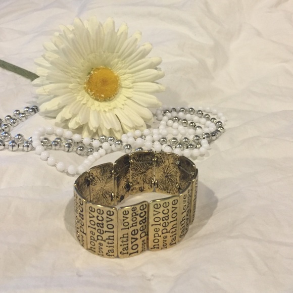 Gold bangle with word design