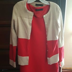 A cappichino cardigan with a poppy red stripe
