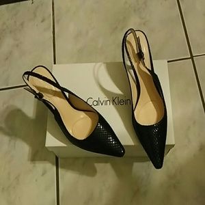 Sling back glossy black heel