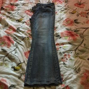 Light jeans size 16 with embroidered pockets.