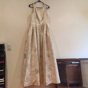 An ivory colored prom dress