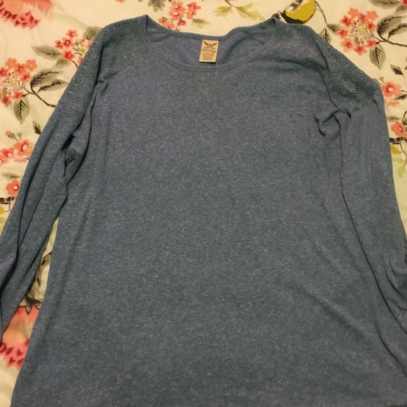 L juniors. Light blue top.