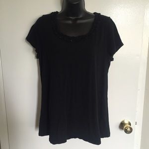 Large black top with detail in the neck line