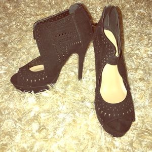 Black platform heels with cutouts