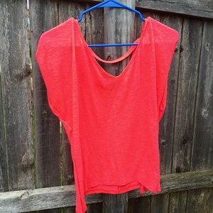 Bright orange top with open back.