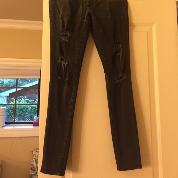 Black ripped jeans been worn