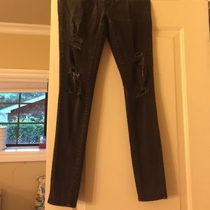 Black ripped jeans been worn