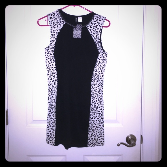 White leopard and black dress