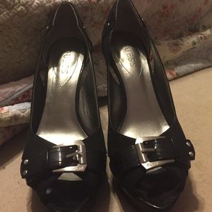Black peep toe heels with buckle detail