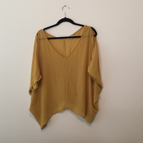 Top with slits in arms