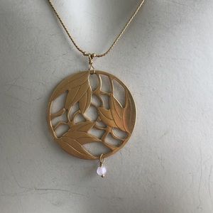 Gold colored pendant necklace
