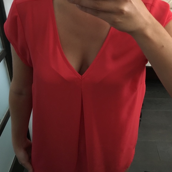 Coral pink blouse with vneck front and back.
