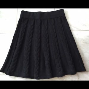 Black A-line knit skirt with braided pattern