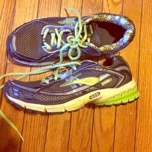 Black yellow and green brooks sneakers
