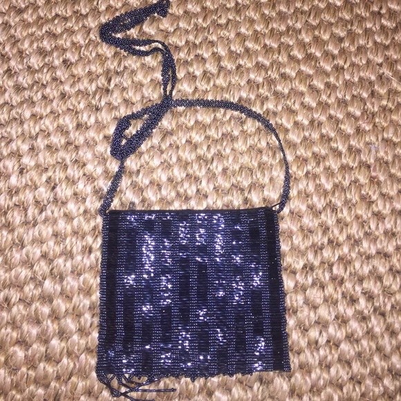 Small, sparkly golden blue purse