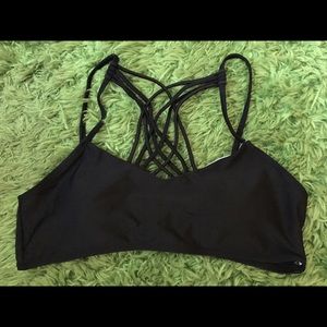 Black cross-stringed bathing suit top