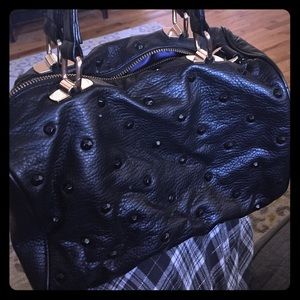 Purse with gold hardware and beautiful inside.