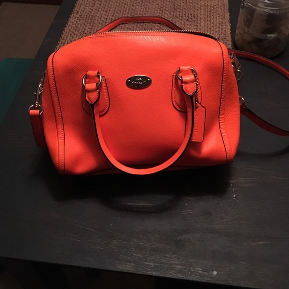 Bright orange Coach purse