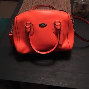 Bright orange Coach purse