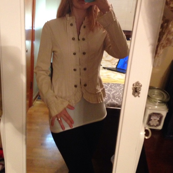 Fun, flirty, and professional tan ruffled jacket