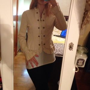 Fun, flirty, and professional tan ruffled jacket