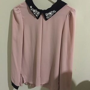 Pink blouse with black, pretty studs on the collar