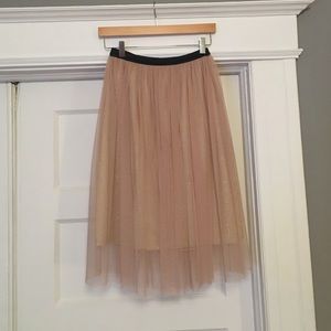 Ballerina like mid length skirt.