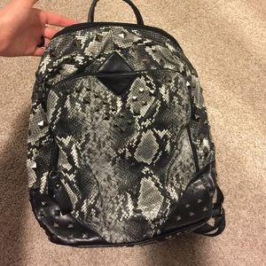 Snake print backpack with studs