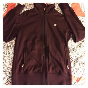 Nike jacket! It's a red purple color!