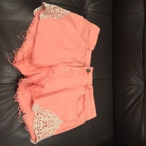 Coral and white lace shorts