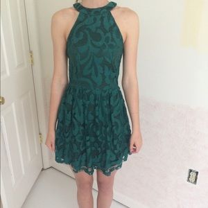 Emerald green high neck lace skater dress