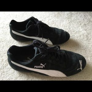 Black and white suede Puma sneakers