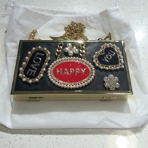 Small clutch with Pearl and rhinestone designs