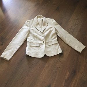 Ivory blazers with gold threading.