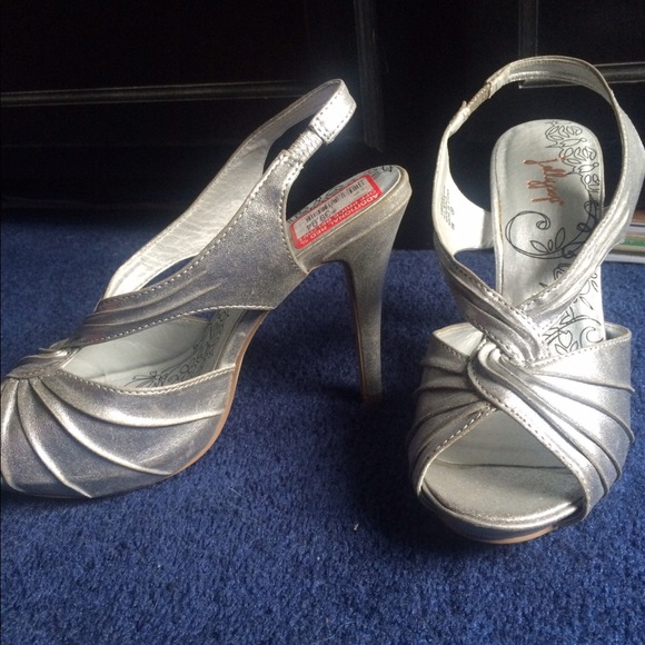 Silver platform heels. Never worn. 4" heel