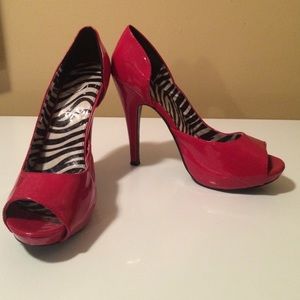 Red peep toe 4 inch heels. Size 9. Minimal wear.