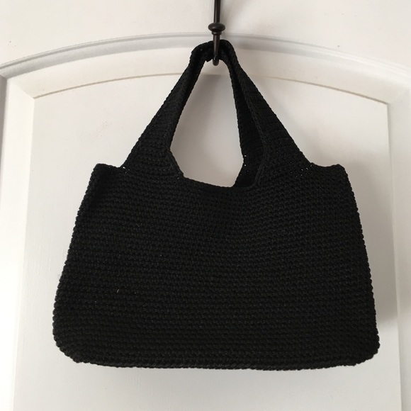 Small, black woven handbag