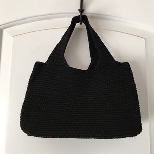 Small, black woven handbag