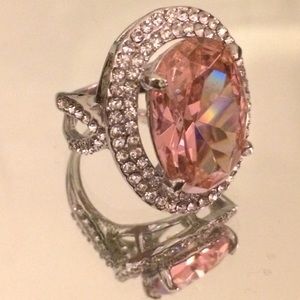 Silver tone cocktail ring with pink crystal.