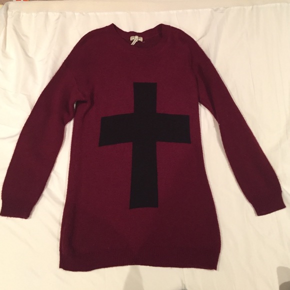 Kirra sweater with a cross on it