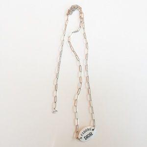 Christian Dior black & white tag necklace.